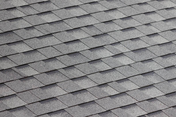 istock close up grey roof shingle. dark asphalt flat tiles seamless pattern. 1453541955