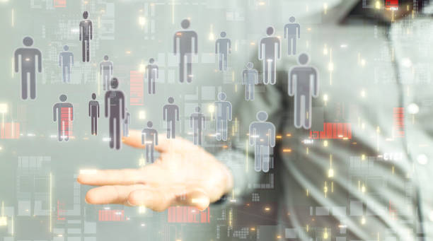 istock 3D rendering of human icons over a hand-social network communication concept 1453542700
