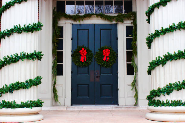 Red door with Advent wreath (door wreath) in Germany