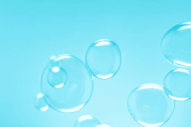 istock Freshness of Transparent Soap Bubbles Abstract Background. Soap Sud Bubbles Water. 1453556951