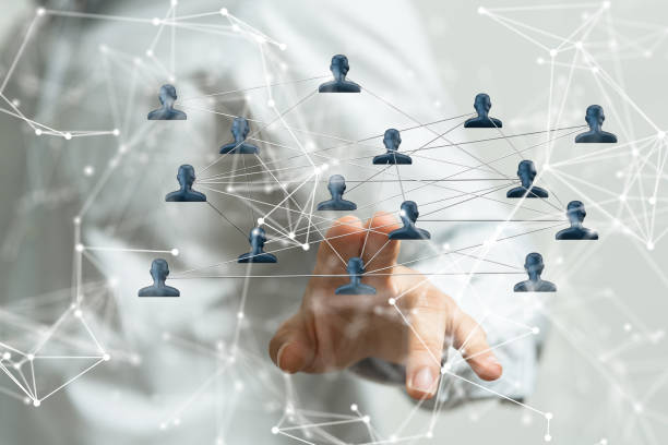 istock Network graphic with blue icons with a person's hand touching it from the backgroundt 1453568204