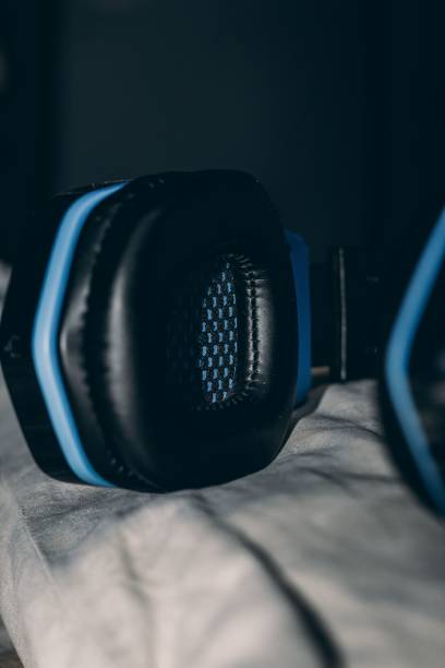 istock Vertical shot of a blue and black headset placed on a white cloth 1453568739