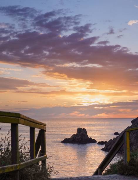 istock Beautiful sunset and a cloudy sky over the Campelo Beach 1453570150