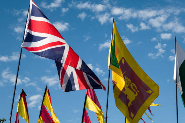 istock Closeup of flags with a blue sky background 1453571176