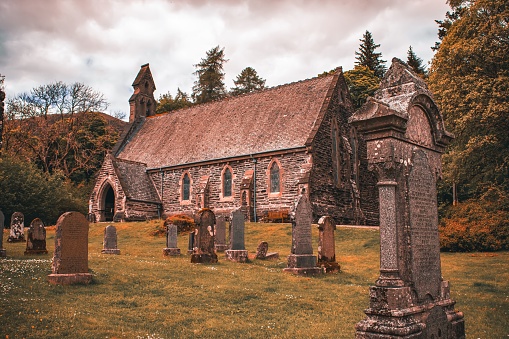 The cemetery of Balquhidder Parish church on a cloudy day in Lochearnhead, Scotland, United Kingdom
