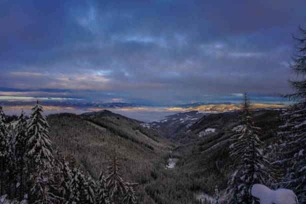 istock Rocky mountains partly covered with snow during sunset 1453573536