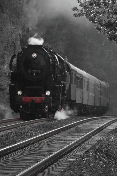istock Selective color of steam train with railways with misty background 1453574484