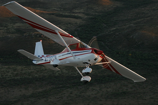 Tucson, United States – October 30, 2010: The Cessna 150 Aerobat A150M flying formation desert mountains