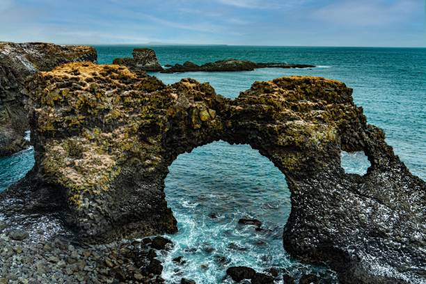 istock Beautiful view of the Gatklettur (Arch Rock) in Arnarstapi, West Iceland 1453576593