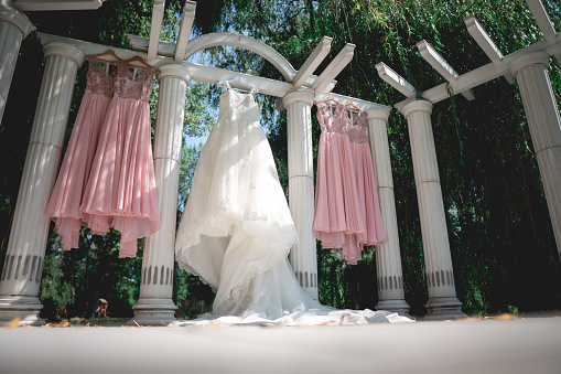 The dresses of the bride and the bridesmaids hung at the venue