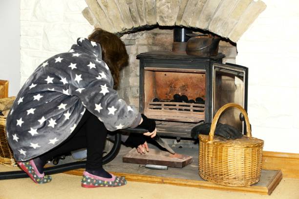 istock Hoovering the ash from the multifuel stove. 1453577137