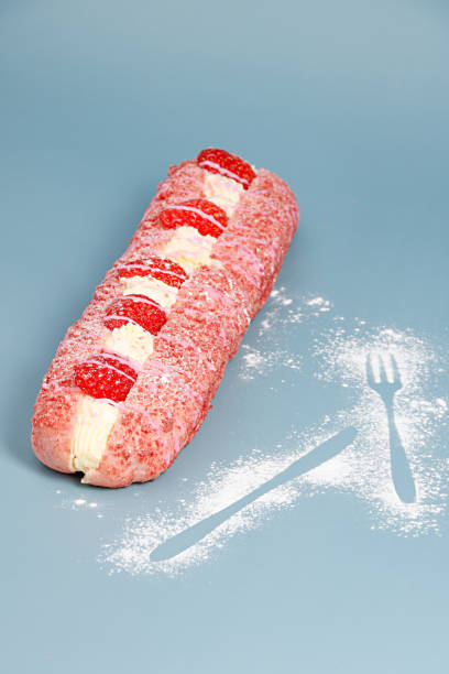 A delicious dessert with cream and strawberries on blue background