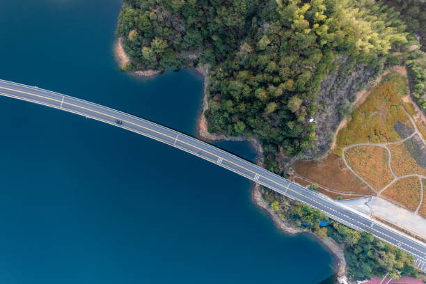 istock Aerial view highway bridge over blue lake 1453577790