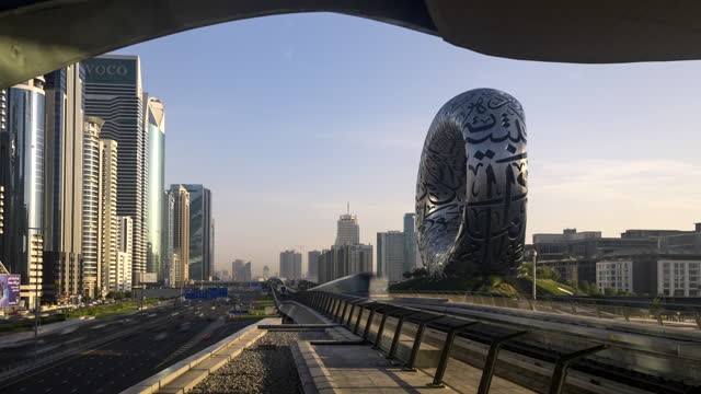 Time lapse of train Dubai metro in high speed passing high rise building in downtown.