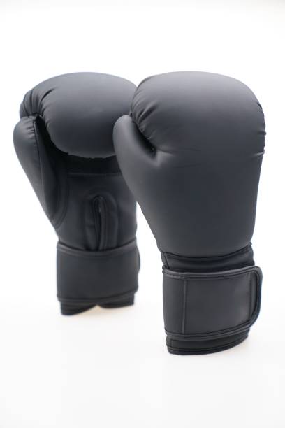 istock Pair of black boxing gloves isolated on a white background 1453580353