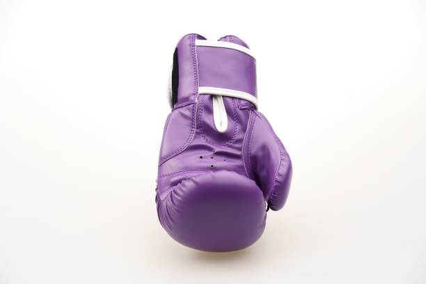 istock Single purple boxing glove isolated on a white background 1453580412