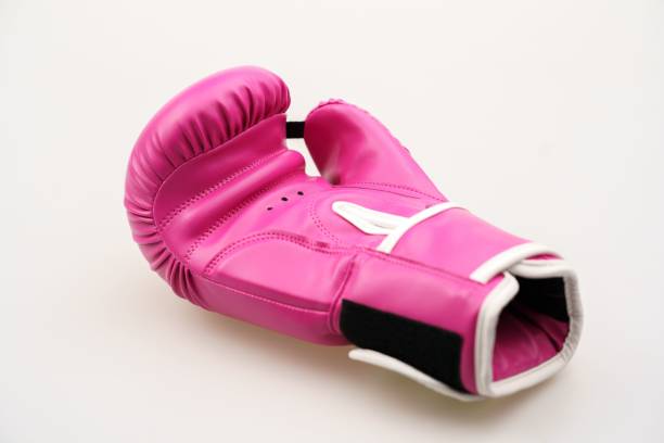 istock Single pink boxing glove isolated on a white background 1453580457