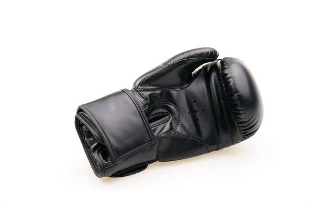 istock Single black boxing glove isolated on a white background 1453580606