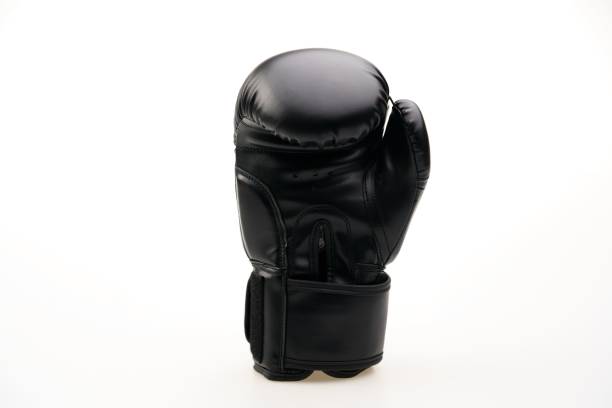 istock Single black boxing glove isolated on a white background 1453580646