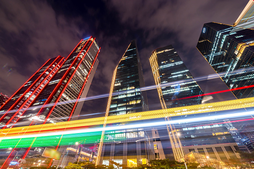 Night time lapse of a busy road in Yeouido transit center and famous skyscrapers in the background in Seoul City South Korea.