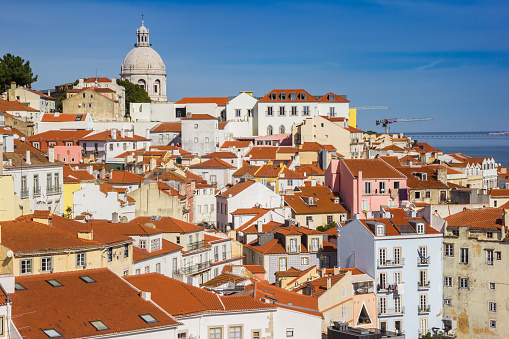 Colorful houses and the dome of the Santa Engracia church in Lisbon