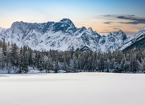 Beautiful view of the Laghi di Fusine lakes near Tarvisio in Italy on a white winter day