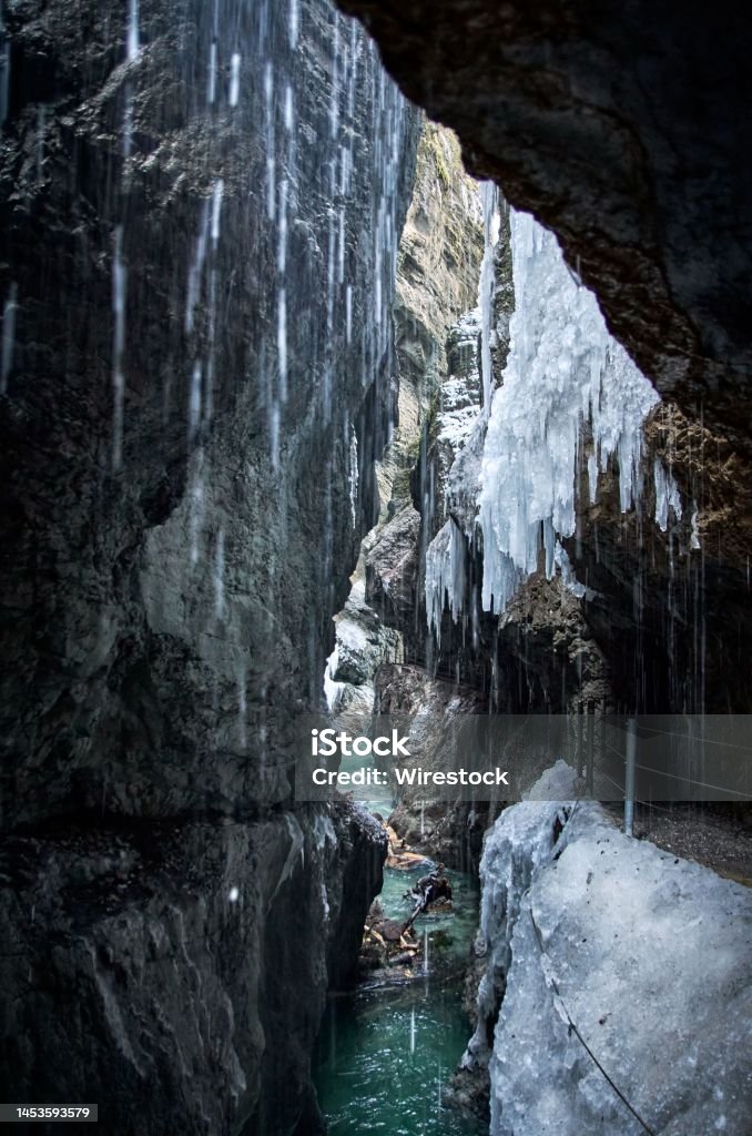 Partnacklamm Gorge in Garmisch-Partenkirchen, Germany with ice hanging from the edge of cliffs The Partnacklamm Gorge in Garmisch-Partenkirchen, Germany with ice hanging from the edge of cliffs Adventure Stock Photo