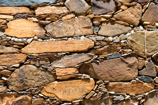 istock stone wall texture in an abandoned village 1453594218