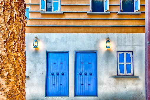 Colourful houses with blue doors and window shutters in a zone of Abha, in the Assir region of Saudi Arabia