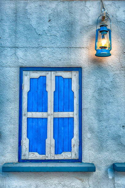 Colourful houses with blue doors and window shutters in a zone of Abha, in the Assir region of Saudi Arabia