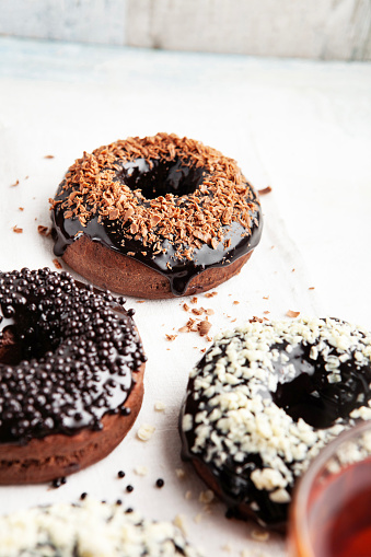 Doughnut, Chocolate, Sugar Sprinkles, Brown, Backgrounds, Food and drink, Baked, Baked Pastry Item, Bakery, Cake, Candy, Sweet Food, Variation, Glazed Food, Group Of Objects