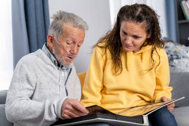 istock Grandad showing his daughter memories from past 1453596967