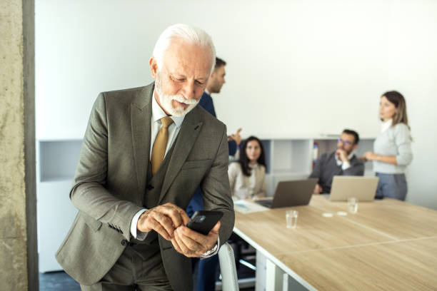 istock Portrait of Successful active senior male working in a office 1453599574