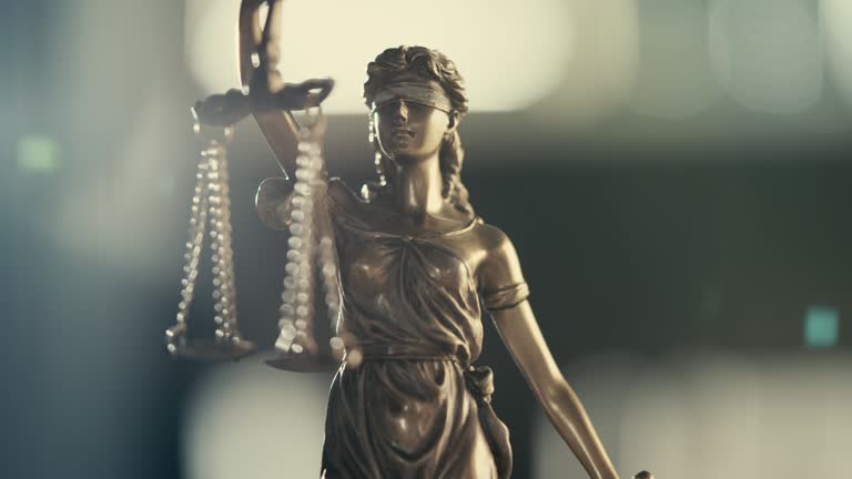 Legal and law concept statue of Lady Justice on blurred background