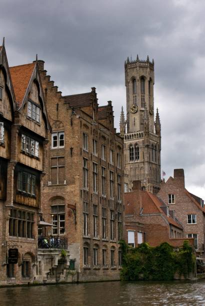 istock Vertical shot of old architectures with a clock tower and waterfront under cloudy sky 1453604607