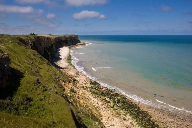 istock Beautiful sea view with a cliff beachline and blue cloudy sky 1453605737