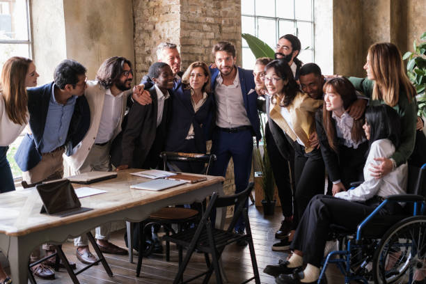 istock Group of businessmen from different cultures joining forces in a work team 1453607651