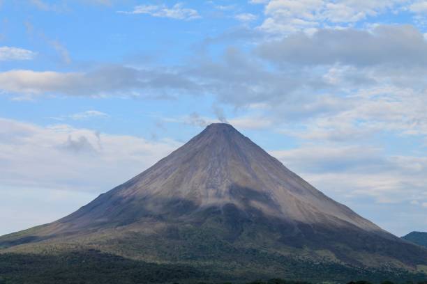 istock Huge volcanic mountain with blue sky in the background 1453607808