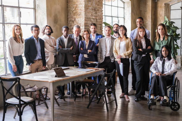istock Group of multicultural businesspeople standing at team meeting 1453608542