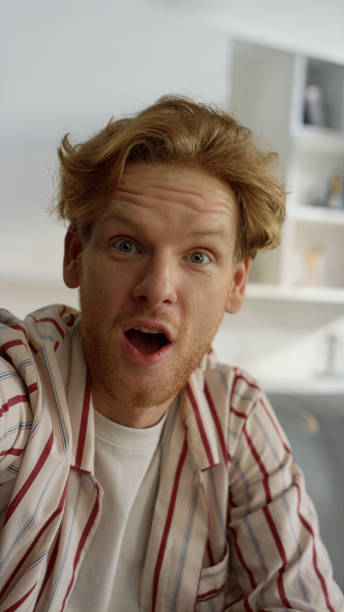 istock Closeup positive guy chatting online with family home. Impressed face expression 1453609589