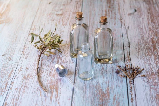 istock Home made Lavender Essential oil empty bottles on wood table 1453613148