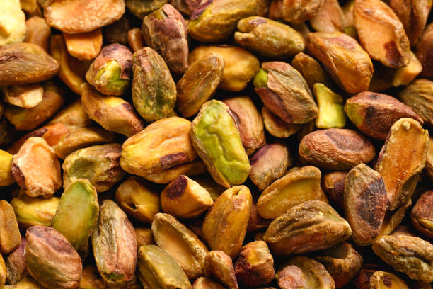 Roasted pistachios without shells background. Healthy food Roasted pistachios without shells background. Healthy food. Pistachio stock pictures, royalty-free photos & images