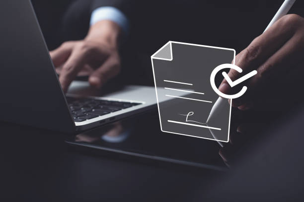 istock E-signing, electronic signature, document management concept. Businessman using stylus pen signing to approve digital document on digital tablet, paperless office 1453618745