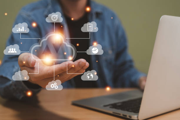 istock Selective focus at the icon with hand of human that holding cloud icon while who using internet and personal cloud storage to keep information and payment data, upload over the internet. 1453626843
