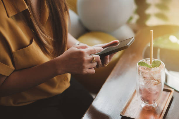 istock Woman preparing to photograph cakes and drinks 1453627119