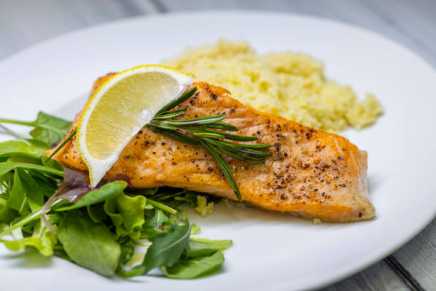 istock grilled salmon served with couscous and vegetables salad 1453628704
