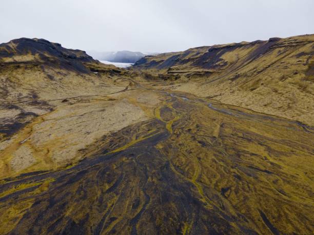 istock Scenic view to a valley with riverbed and road in Iceland 1453629478