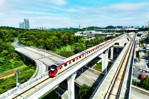 istock Commuter train rides on elevated bridge in a city. 1453632150
