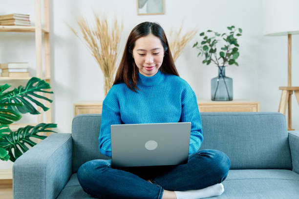 istock Focused woman working on laptop 1453632153