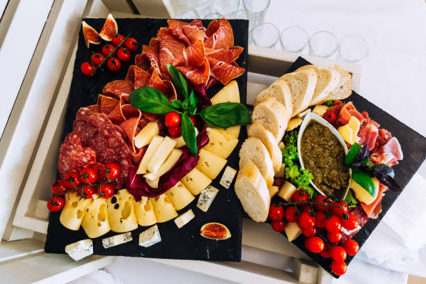 istock Different meals for the guests on banquet table. Serving table f 1453634207